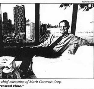 Gary MacDougal, chief executive of Mark Controls Corp., seated by a window overlooking the Chicago skyline